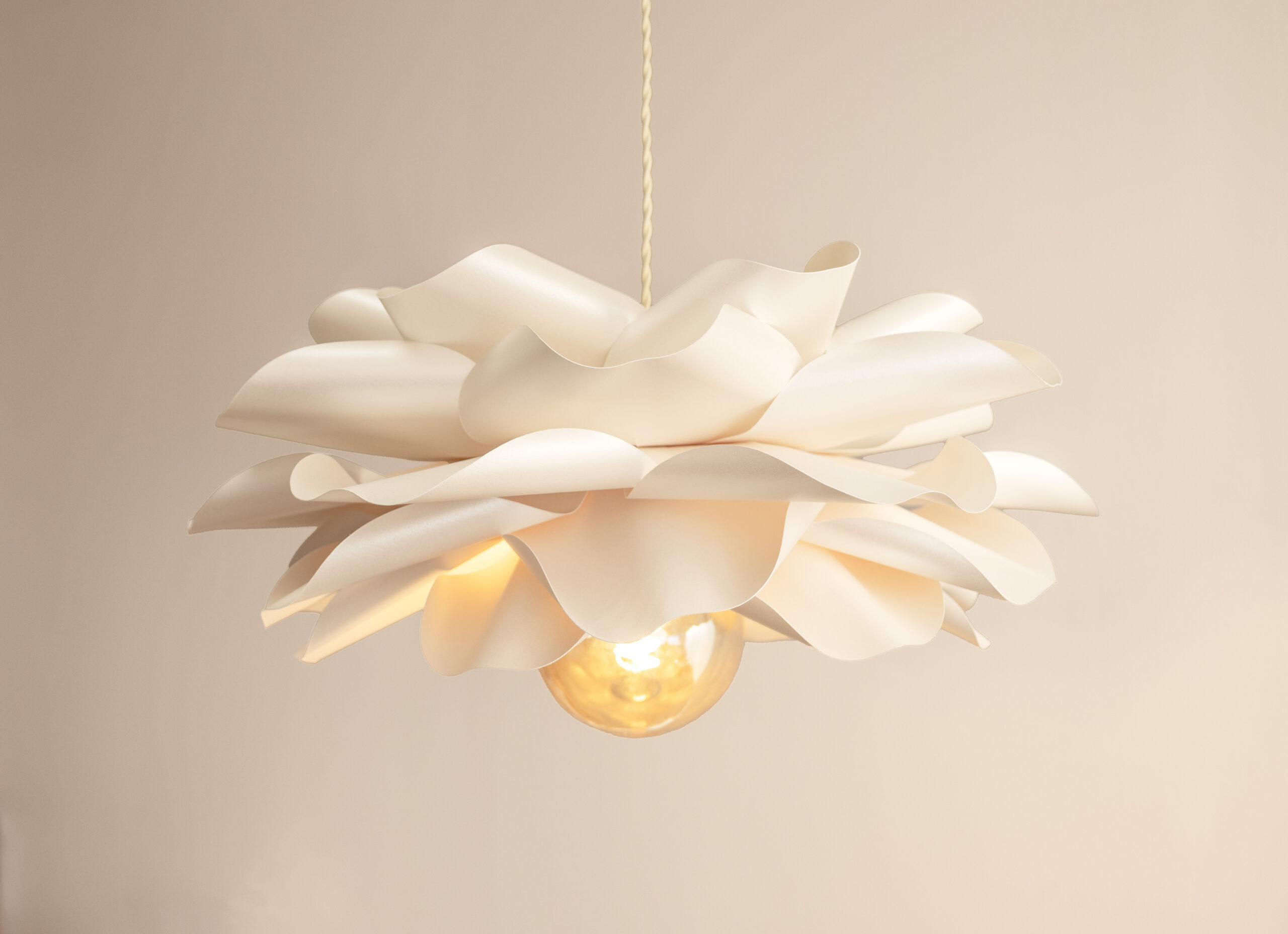 Sculptural handmade flower pendant lamp in soft neutral tones for cozy interiors