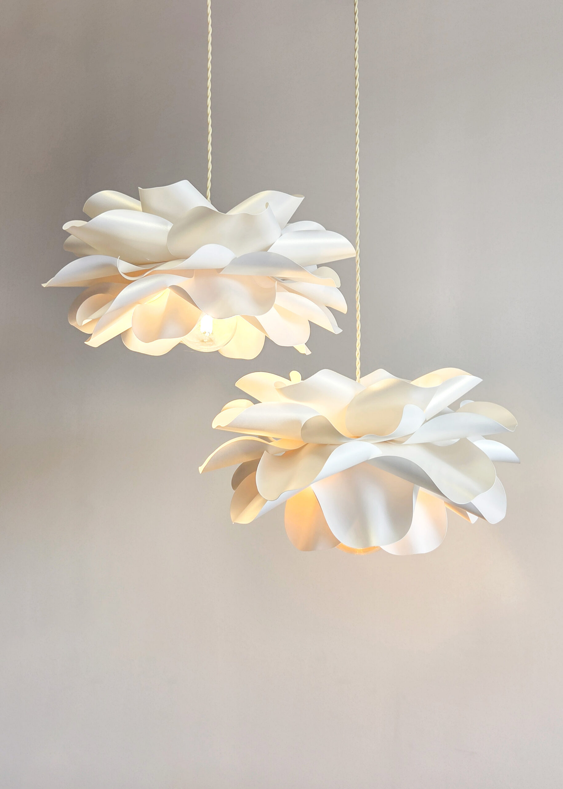 Modern flower pendant lamp set in warm neutral interior