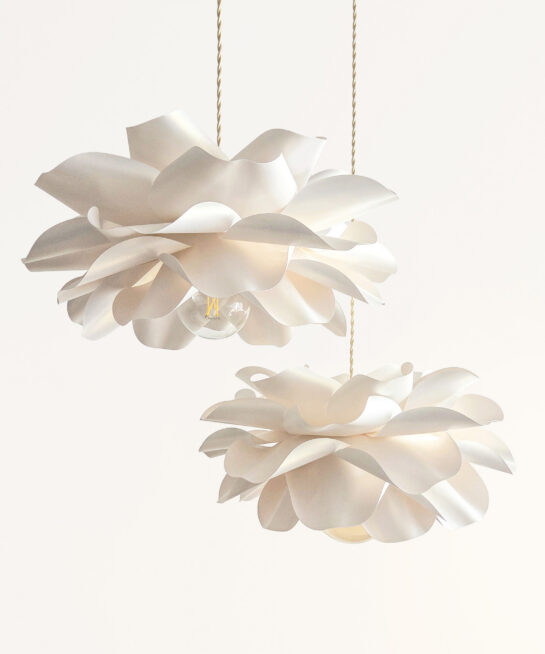 Soft ivory flower pendant lights set with sculptural layered petals