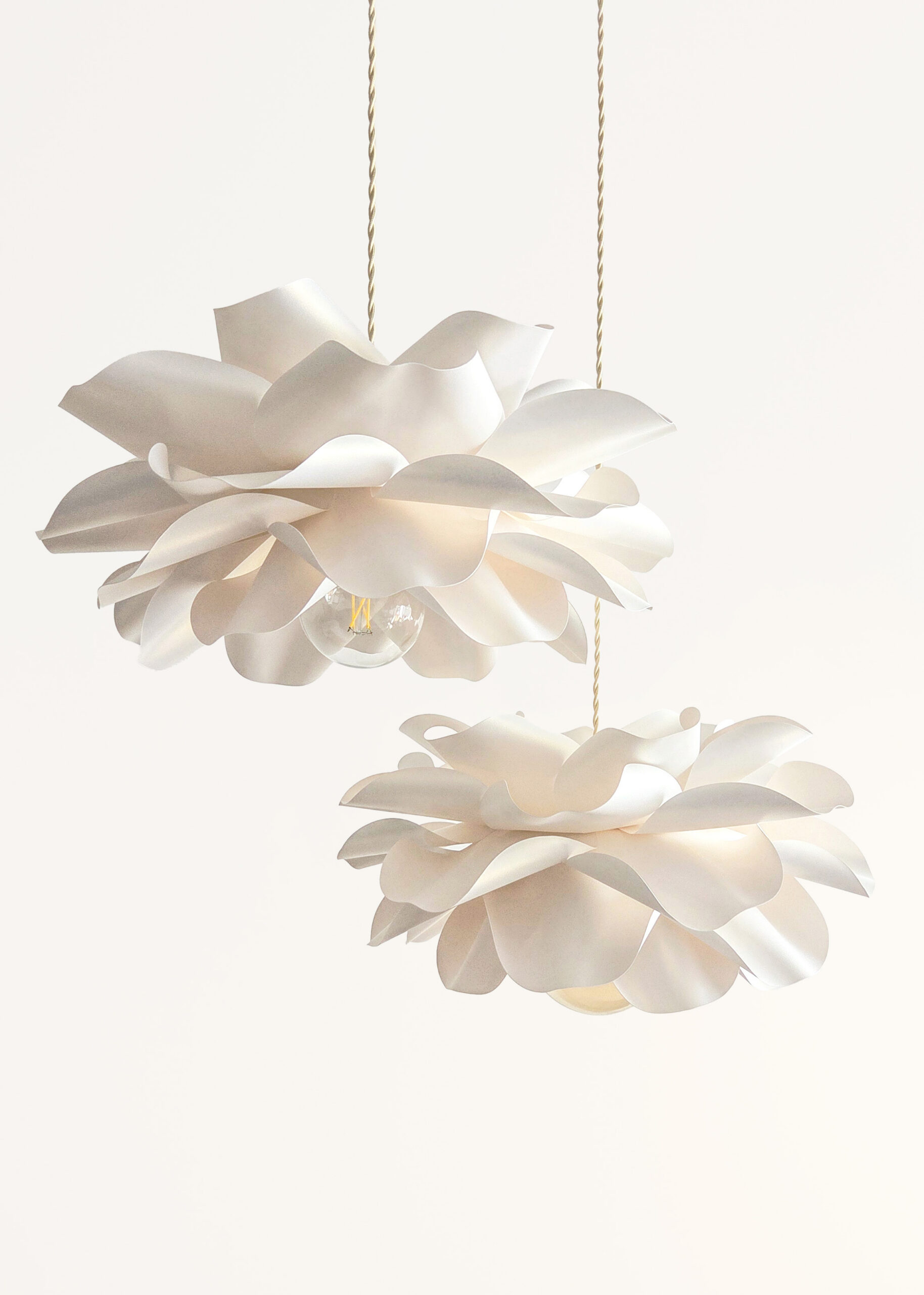 Soft ivory flower pendant lights set with sculptural layered petals